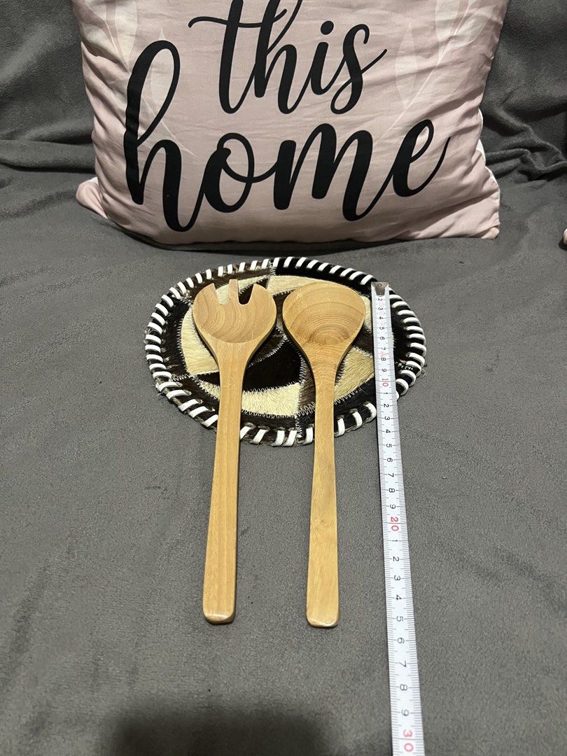 Wooden Salad Servers with Decorative Base (Category: Dinnerware & Cutlery) located in Las Pinas. Submitted by maple0305 (Listing ID 1463436286, Image 3). Description: - Set includes one wooden salad fork and one wooden salad spoon. - Features a unique decorative base with a cowhide-like pattern and black/white trim. - Ideal for serving salads or other dishes. - Adds a rustic, charming touch to any table setting. - Each server measures approximate