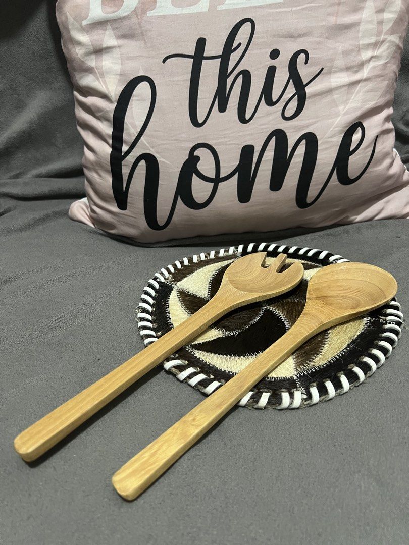 Wooden Salad Servers with Decorative Base (Category: Dinnerware & Cutlery) located in Las Pinas. Submitted by maple0305 (Listing ID 1463436286, Image 1). Description: - Set includes one wooden salad fork and one wooden salad spoon. - Features a unique decorative base with a cowhide-like pattern and black/white trim. - Ideal for serving salads or other dishes. - Adds a rustic, charming touch to any table setting. - Each server measures approximate