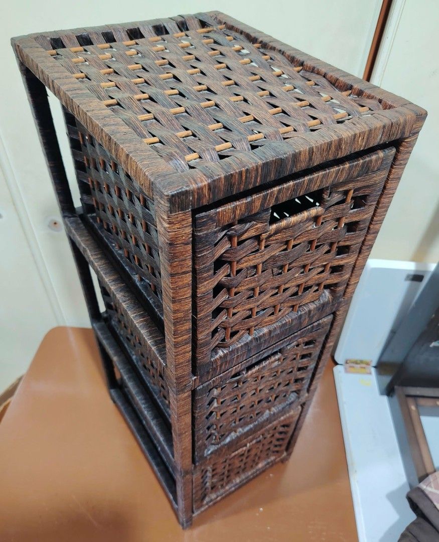 Woven 3-Drawer Storage Cabinet Organizer (Category: Shelves, Cabinets & Racks) located in Caloocan City. Submitted by sydney08.owl (Listing ID 1463459047, Image 3). Description: - Tall woven storage cabinet in dark brown. - Made of durable rattan or similar material. - Features three spacious drawers for organizing small items. - Compact dimensions: L-9.75" x W-12.5" x H-28". - Ideal for maximizing space in tight areas..