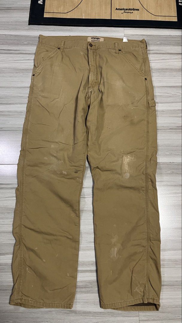 Wrangler Authentics Khaki Carpenter Pants (Category: Jeans) located in Cabuyao City. Submitted by bulandos (Listing ID 1463435012, Image 2). Description: - Wrangler Authentics khaki carpenter pants - Durable workwear style - Features stains and marks consistent with work pants - Small patch on right thigh - Small tear on left leg - Still has plenty of life for work or casual wear.