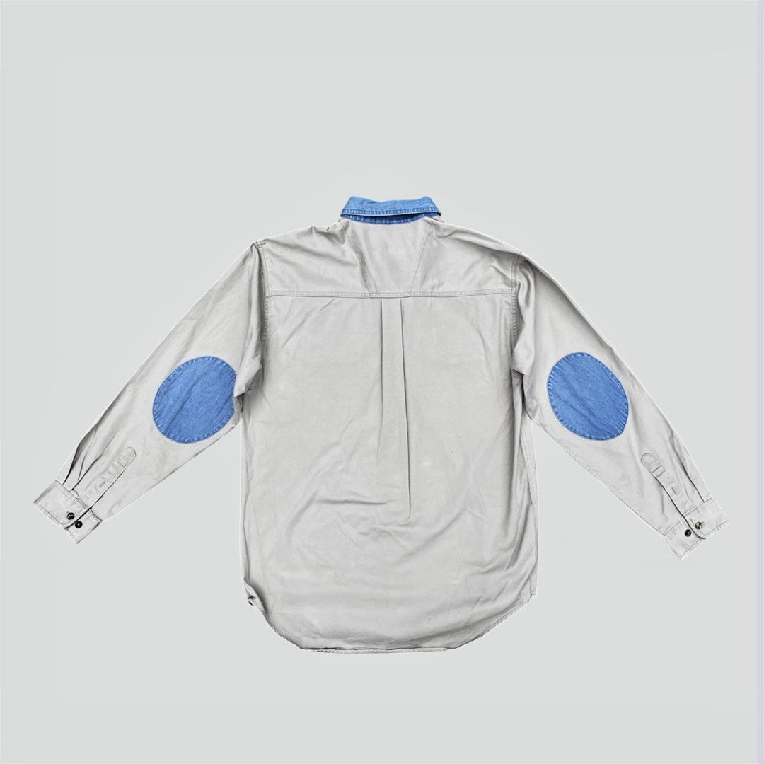 Wrangler Workwear (Category: Tshirts & Polo Shirts ) located in Calamba. Submitted by juan_jawnz (Listing ID 1463395305, Image 2). Description: Wrangler contrast collar Patch Shirt PHP 880 Length - 30.5 F, 32.5 B Inches Width - 23 Inches Shoulder - 20 Inches Sleeve - 25.5 Inches Off-white / light stone canvas with light-wash denim contrast collar + oval elbow patches. Dual flap chest pockets, long sleeves with button cuffs. Back box pleat. Workwe