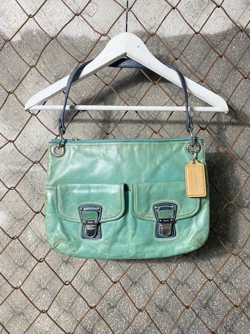 Y2k Coach Leather Shoulder Bag (Category: Activewear) located in Cabanatuan. Submitted by adrialesdrip (Listing ID 1463503228, Image 1). Description: - Coach teal leather shoulder bag - Features two front pockets with secure buckle closures - Top zipper closure for main compartment security - Comes with original Coach leather hangtag - Dark blue shoulder straps -see all details .