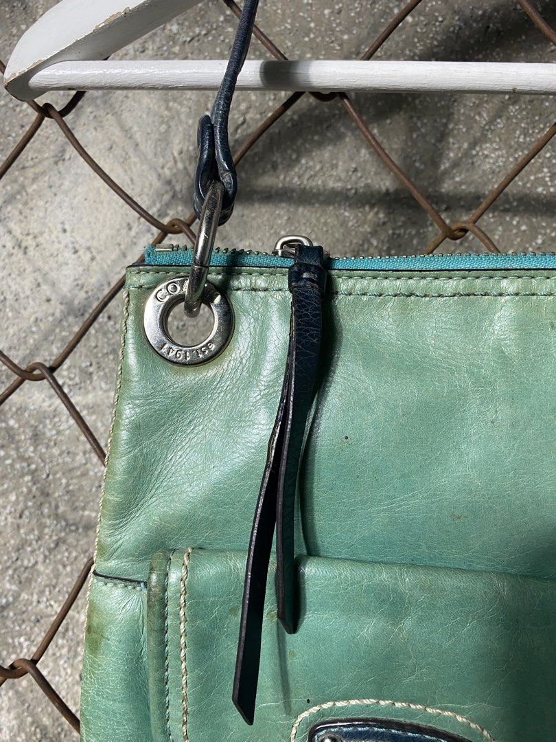 Y2k Coach Leather Shoulder Bag (Category: Activewear) located in Cabanatuan. Submitted by adrialesdrip (Listing ID 1463503228, Image 3). Description: - Coach teal leather shoulder bag - Features two front pockets with secure buckle closures - Top zipper closure for main compartment security - Comes with original Coach leather hangtag - Dark blue shoulder straps -see all details .