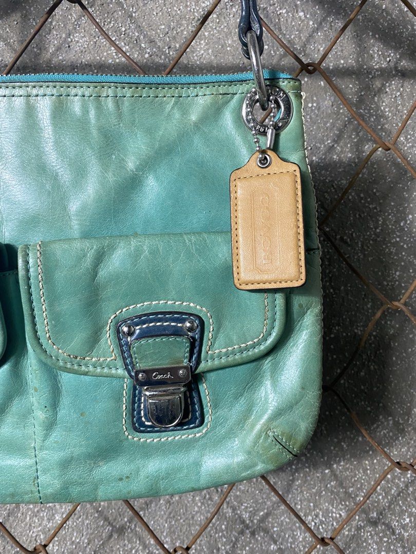 Y2k Coach Leather Shoulder Bag (Category: Activewear) located in Cabanatuan. Submitted by adrialesdrip (Listing ID 1463503228, Image 2). Description: - Coach teal leather shoulder bag - Features two front pockets with secure buckle closures - Top zipper closure for main compartment security - Comes with original Coach leather hangtag - Dark blue shoulder straps -see all details .