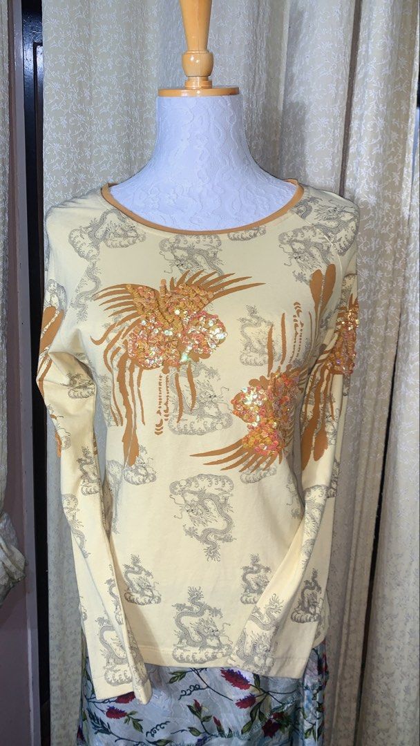 Yellow Dragon & Phoenix Sequin Long Sleeve Top (Category: Longsleeves) located in Dagupan City. Submitted by sj_styles0910. (Listing ID 1463533407, Image 1). Description: - Creamy yellow long-sleeved top - All-over print of dragons and clouds - Large sequined phoenix design on front and back - Sequins in a mix of orange and pink - Crew neckline - Perfect statement piece.