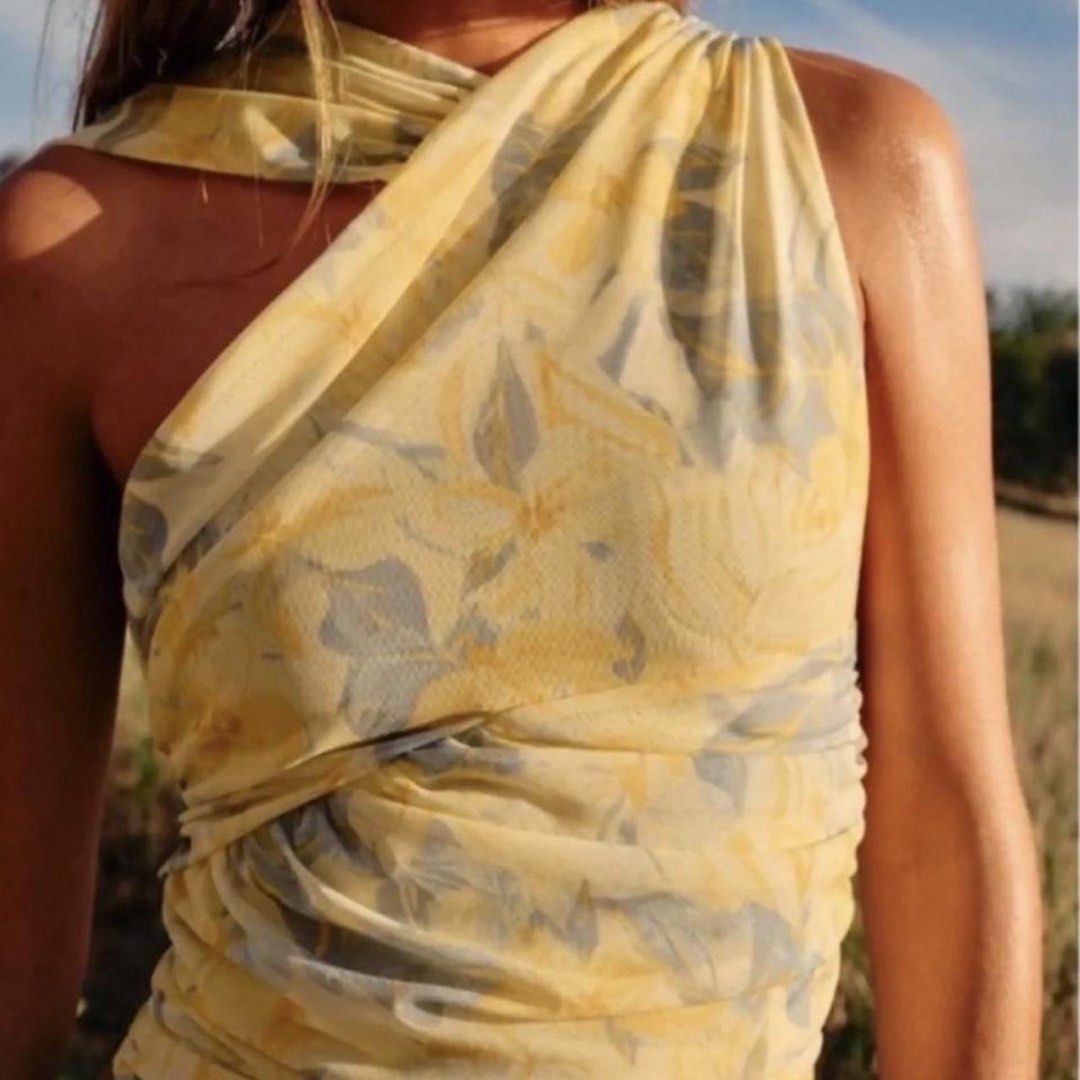 Yellow Floral One Shoulder Ruched Bodysuit (Category: Others Tops) located in Cavite. Submitted by handpickedbyisha (Listing ID 1463519575, Image 1). Description: - Adorable yellow one-shoulder bodysuit - Features a charming floral print - Stylish ruching details on the side - Made from lightweight and flowy fabric - Versatile: perfect for beach days or nights out - Easily pairs with shorts or skirts.