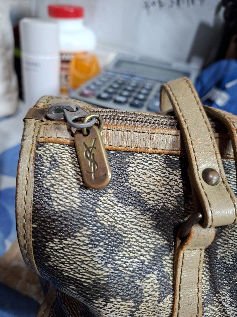 Yves Saint Laurent YSL Monogram Boston Bag (Category: Luxury Bags & Wallets) located in Lucena. Submitted by dai_suki (Listing ID 1463475608, Image 3). Description: - Authentic vintage YSL monogram boston bag - Classic YSL monogram pattern - Genuine leather trim and handles - Secure zipper closure - Ideal for everyday use or travel - Features authentic YSL hardware.