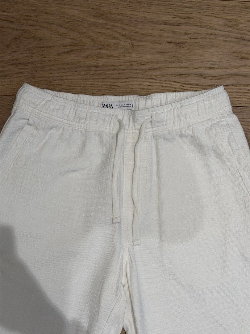 Zara: 100% Cotton Textured White Pants (Category: Trousers) located in Quezon City. Submitted by joes3 (Listing ID 1463338931, Image 3). Description: Zara: 100% Cotton Textured White Pants Color: White Size: Small Details: - Has elastic Waistband - Textured cotton Fabric - has Drawstring - Looks like Linen Pants Measurements: Length: 37-37.5” Waist: 15” (can expand to +.5 inches due to elastic waistband) Great Condition— no issues.
