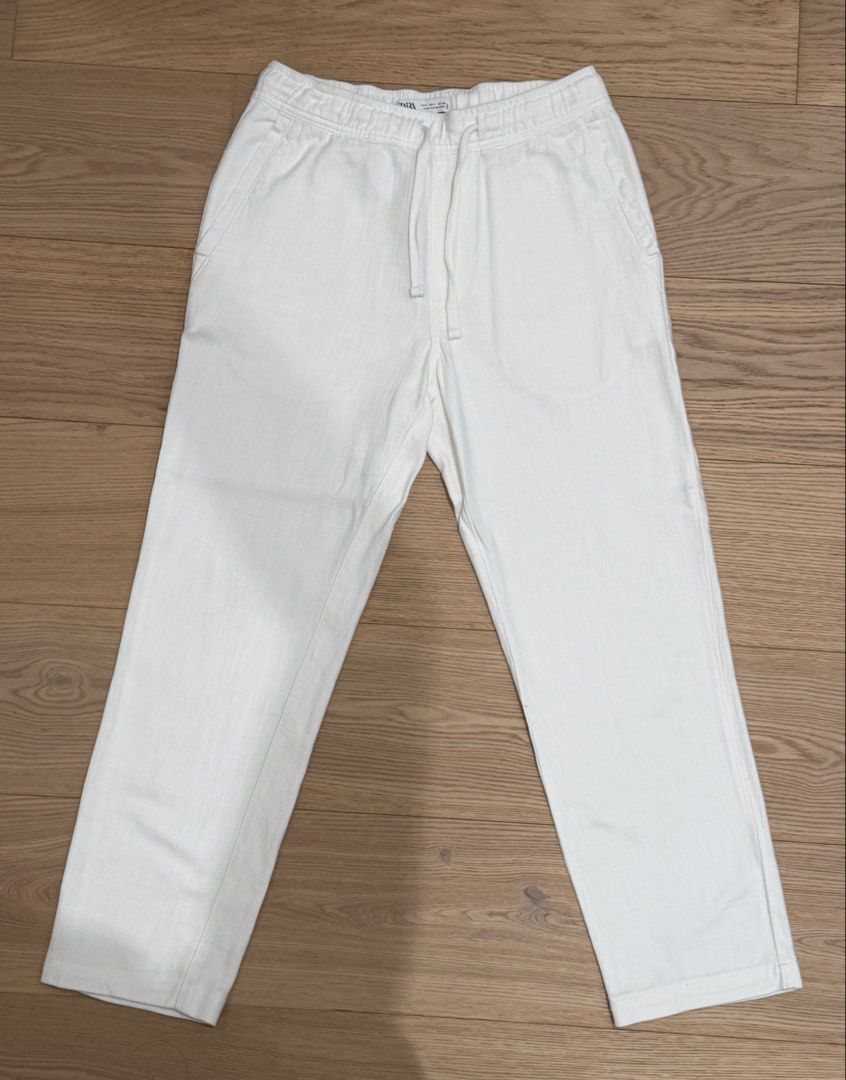 Zara: 100% Cotton Textured White Pants (Category: Trousers) located in Quezon City. Submitted by joes3 (Listing ID 1463338931, Image 1). Description: Zara: 100% Cotton Textured White Pants Color: White Size: Small Details: - Has elastic Waistband - Textured cotton Fabric - has Drawstring - Looks like Linen Pants Measurements: Length: 37-37.5” Waist: 15” (can expand to +.5 inches due to elastic waistband) Great Condition— no issues.