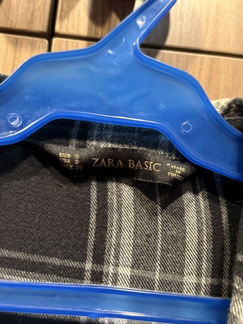 Zara Basic Plaid Long Sleeve Shirt (Category: Shirts) located in Marikina City. Submitted by samndbx (Listing ID 1463353470, Image 2). Description: - Classic black and gray plaid pattern - Flannel style perfect for Fall fashion - Button-up style - Single chest pocket - Long sleeves (can be rolled up) - Comfortable and casual design - Versatile for layering or wearing solo Width: 50cm Can fit Medium.