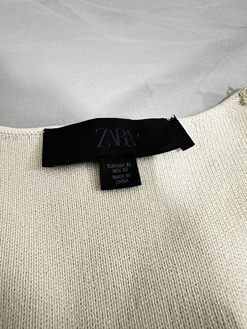 ZARA Cream Ribbed Button-Up Vest XL (Category: Sleeveless) located in Manila. Submitted by everythingsale101 (Listing ID 1463428825, Image 3). Description: -Brand new no tag - Cream-colored vest from ZARA - Size XL - Ribbed texture all over - Gold button details down the front - V-neckline - Split hem at the bottom - Ideal for layering over tops or dresses.