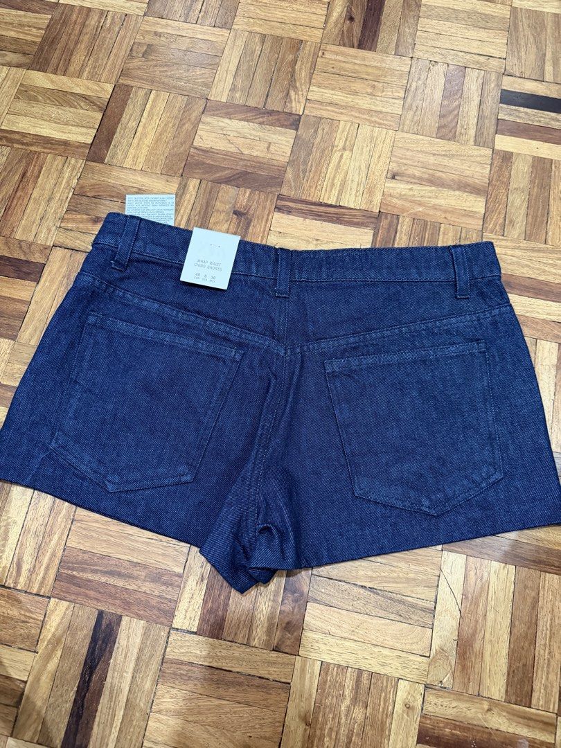 Zara Denim Shorts Size 40 (Category: Shorts) located in Manila. Submitted by preloved_new_forsale (Listing ID 1463355035, Image 2). Description: - Zara dark wash denim shorts - High-waisted style - Includes belt detail - Two front and two back pockets - Size 40 - Never worn, tags still attached.