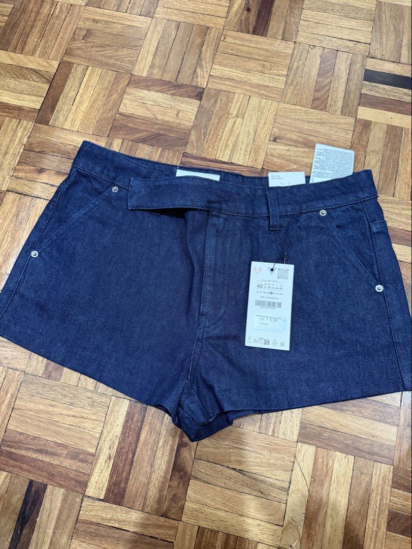 Zara Denim Shorts Size 40 (Category: Shorts) located in Manila. Submitted by preloved_new_forsale (Listing ID 1463355035, Image 1). Description: - Zara dark wash denim shorts - High-waisted style - Includes belt detail - Two front and two back pockets - Size 40 - Never worn, tags still attached.