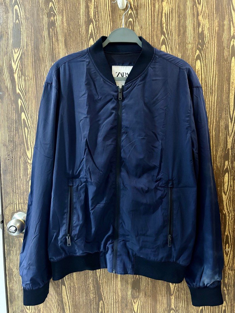 Zara Navy Blue Bomber Jacket (Category: Coats, Jackets and Outerwear) located in Makati City. Submitted by closet_by_mka (Listing ID 1463518264, Image 1). Description: ZARA Navy Bomber Jacket ✨ Only worn a few times — super good condition! Such a clean and versatile jacket! 💙 Love the simple navy color and minimalist bomber style. Easy to throw over almost any outfit. • Classic bomber style • Full zip closure • Ribbed collar, cuffs & hem • Two z