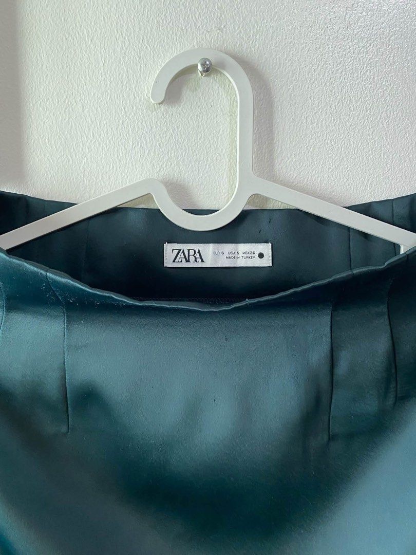 Zara Olive Satin Mini Skirt Size (Category: Skirts) located in Caloocan City. Submitted by favestop (Listing ID 1463464222, Image 2). Description: - Zara Teal Satin Mini Skirt - High Waisted & Structured Fit - Asymmetrical Hemline - Estimated Size: S - Measurements: Length 16 inches, Waist 26 inches - Made in Turkey.