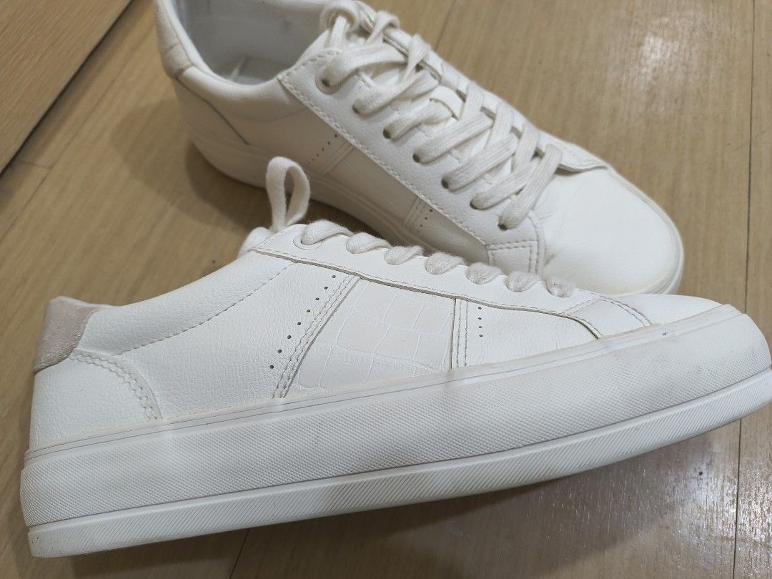 ZARA White Sneakers Size 38 (Category: Sneakers) located in Manila. Submitted by hakunaematata (Listing ID 1463356306, Image 2). Description: - ZARA White Sneakers - Size: 38 - Style: Classic low-top with laces - Features: Subtle textured detail on the side, platform sole - Perfect for: Casual wear - Condition: Please check photos for details.