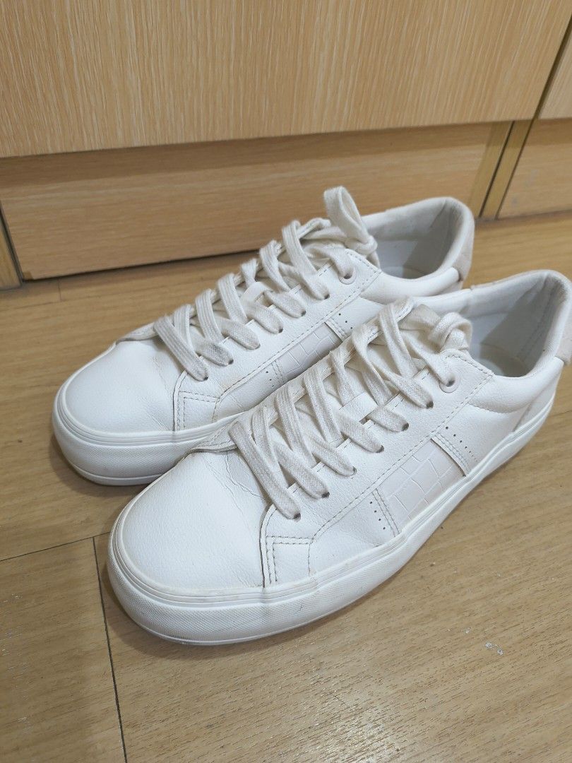 ZARA White Sneakers Size 38 (Category: Sneakers) located in Manila. Submitted by hakunaematata (Listing ID 1463356306, Image 1). Description: - ZARA White Sneakers - Size: 38 - Style: Classic low-top with laces - Features: Subtle textured detail on the side, platform sole - Perfect for: Casual wear - Condition: Please check photos for details.