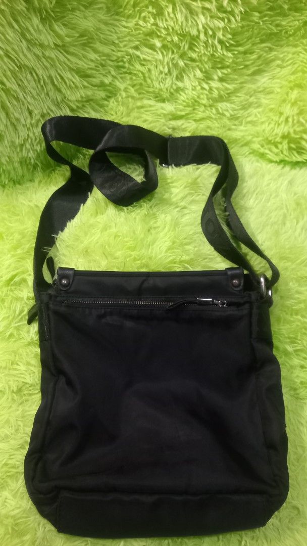 ZOFAN Black Nylon Crossbody Bag (Category: Cross-body Bags) located in Manila. Submitted by twinklelyn03 (Listing ID 1463389200, Image 2). Description: - Brand: ZOFAN - Color: Black - Material: Nylon - Style: Crossbody bag - Features: Main zippered compartment, internal pockets, adjustable strap - Ideal for: Everyday use - Condition: Shows some signs of wear on the zipper and strap see photos for details pm sa sure buyer only thank you so much po
