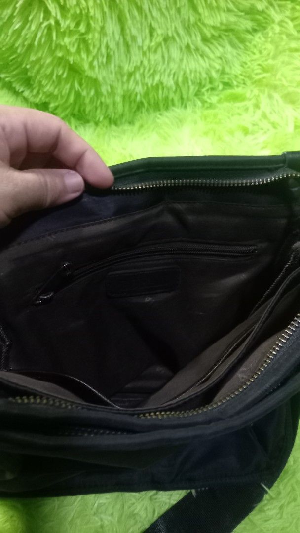 ZOFAN Black Nylon Crossbody Bag (Category: Cross-body Bags) located in Manila. Submitted by twinklelyn03 (Listing ID 1463389200, Image 3). Description: - Brand: ZOFAN - Color: Black - Material: Nylon - Style: Crossbody bag - Features: Main zippered compartment, internal pockets, adjustable strap - Ideal for: Everyday use - Condition: Shows some signs of wear on the zipper and strap see photos for details pm sa sure buyer only thank you so much po