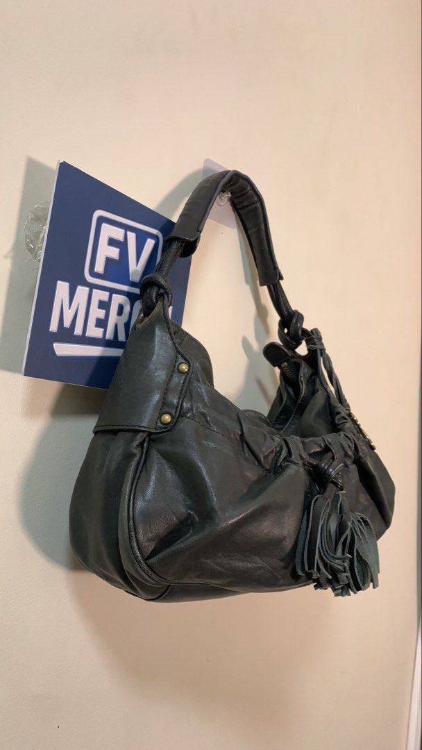 Zucchero Filato (Category: Shoulder Bags) located in Mandaluyong City. Submitted by fv_merch (Listing ID 1463391208, Image 2). Description: ₱1200 Zucchero Filato | Y2k hobo shoulder bag Genuine Italian Leather; 2000s/Y2K era collection Issues: Minor Sign of Usage; no damage More photos in comment section. ⚠ DISCLAIMER: All brand names, logos, and trademarks belong to their respective owners and are used for identification/authenticity purposes on