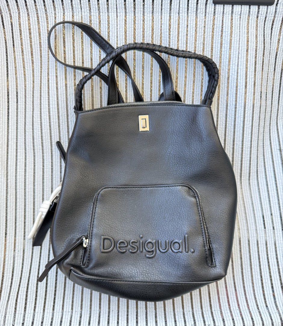 -10.31- USED DESIGUAL Multi-Position Backpack (Category: Backpacks) located in Cebu City. Submitted by nihonfindsbyhimawari26 (Listing ID 1463606514, Image 2). Description: 🚨 NOT YET AVAILABLE FOR PURCHASE ✈️ On the way from Japan 📦 ETA: End of Oct ⸻ 🖤✨ DESIGUAL MULTI-POSITION BACKPACK ✨🖤 Brand: DESIGUAL Style: Convertible Backpack / Handbag / Shoulder Bag Color: Black Material: Grained faux leather Made in: China 🇨🇳 Purchased in: Japan 🇯�