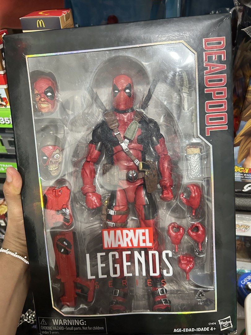12 inches Marvel Legends Deadpool Action Figure with Accessories (Category: Figurines & Statues) located in Muntinlupa City. Submitted by capitalrg (Listing ID 1463567139, Image 1). Description: - Brand new Marvel Legends Deadpool action figure - Still sealed in original packaging - Includes multiple heads, hands, and weapons - A must-have for any Deadpool fan's collection .