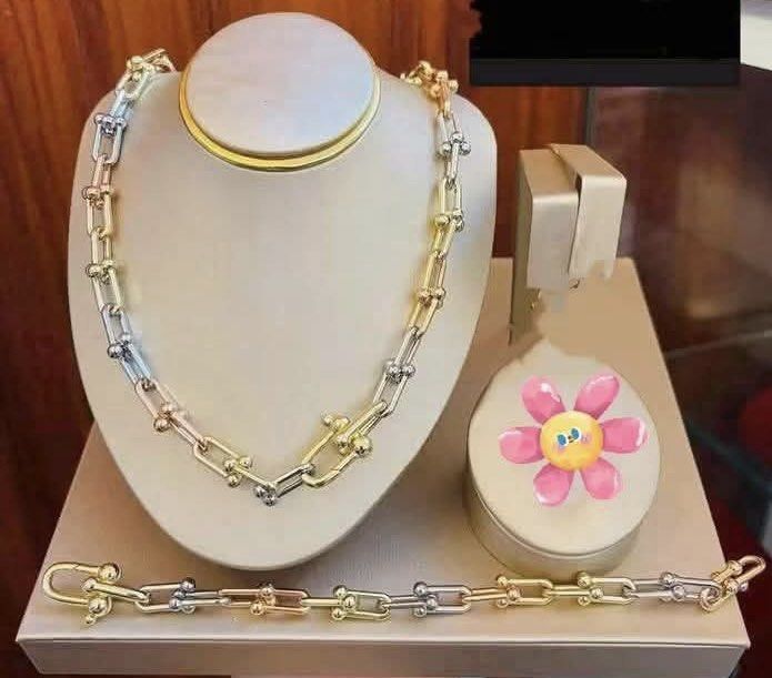 14K Vermiel Set Tiffany (Category: Necklaces) located in Bulacan. Submitted by grazcloset (Listing ID 1463604608, Image 2). Description: - Beautiful tri-color necklace and bracelet set - Mix of yellow gold, white gold, and rose gold tones - Unique horseshoe-shaped links with small bead accents - Secure and easy-to-use clasp - Adds a pop of color and shine to any outfit - Versatile for casual and formal wear.