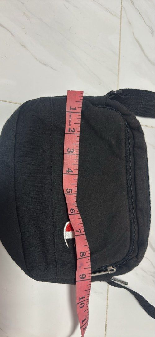 2027 Champion Black Crossbody Bag (Category: Cross-body Bags) located in Silang. Submitted by sari2bilina (Listing ID 1463667725, Image 2). Description: - Authentic Champion crossbody bag - Ideal for everyday essentials - Main zippered compartment for secure storage - Inner pocket for organization - Adjustable strap for a comfortable fit - Compact size: approximately 8" wide, 5" tall, and 2" deep.