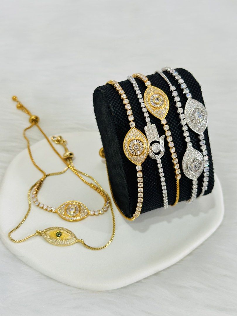 24K Gold Plated Evil Eye & Hamsa Bracelets (Category: Bracelets) located in Makati City. Submitted by rinz11 (Listing ID 1463606105, Image 2). Description: - Ward off negative energy with these beautiful bracelets. - Available in 24K gold plated or rhodium plated. - Made with original Swarovski elements, high-quality pearls, carved beads, and semi-precious stones. - Adjustable chain fits most wrists. - Perfect for everyday wear or as a thoughtful