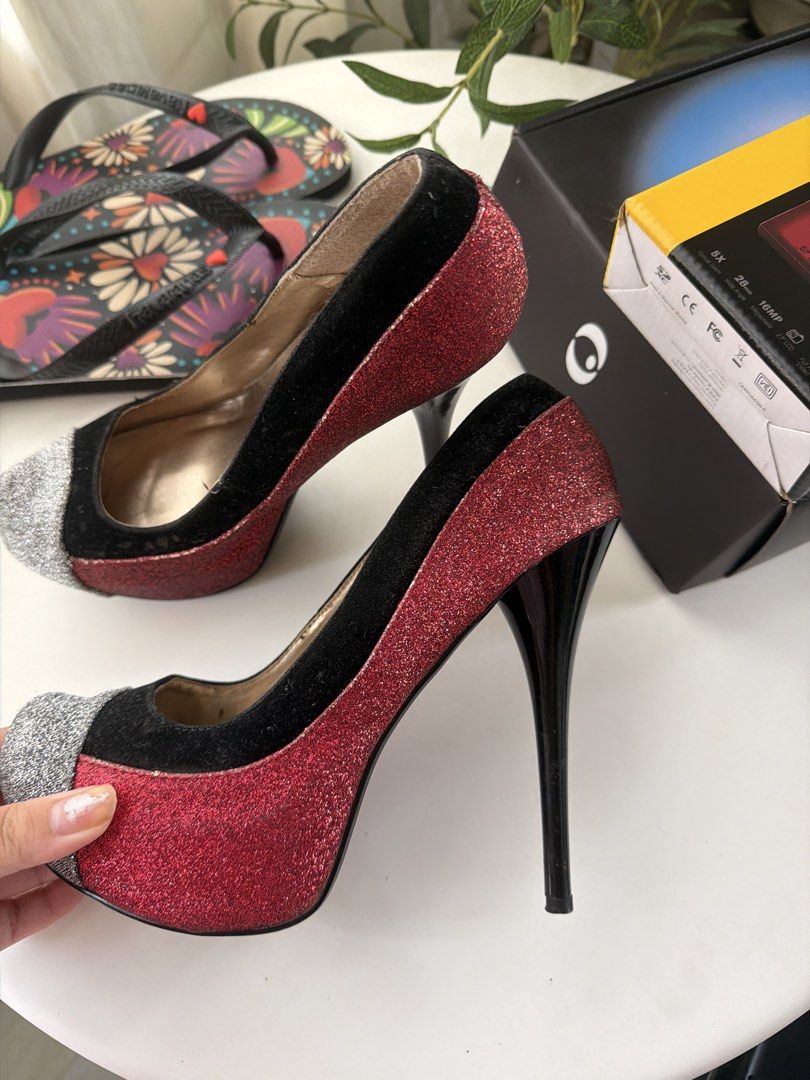 2B Bebe Red Black Glitter Heels (Category: Heels) located in Santa Rosa. Submitted by ninjalei (Listing ID 1463600311, Image 3). Description: - Brand: 2B Bebe - Color: Red and black glitter - Features: Silver cap toe, high stiletto heel - Occasion: Perfect for nights out or special events.