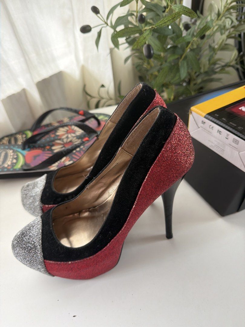 2B Bebe Red Black Glitter Heels (Category: Heels) located in Santa Rosa. Submitted by ninjalei (Listing ID 1463600311, Image 2). Description: - Brand: 2B Bebe - Color: Red and black glitter - Features: Silver cap toe, high stiletto heel - Occasion: Perfect for nights out or special events.
