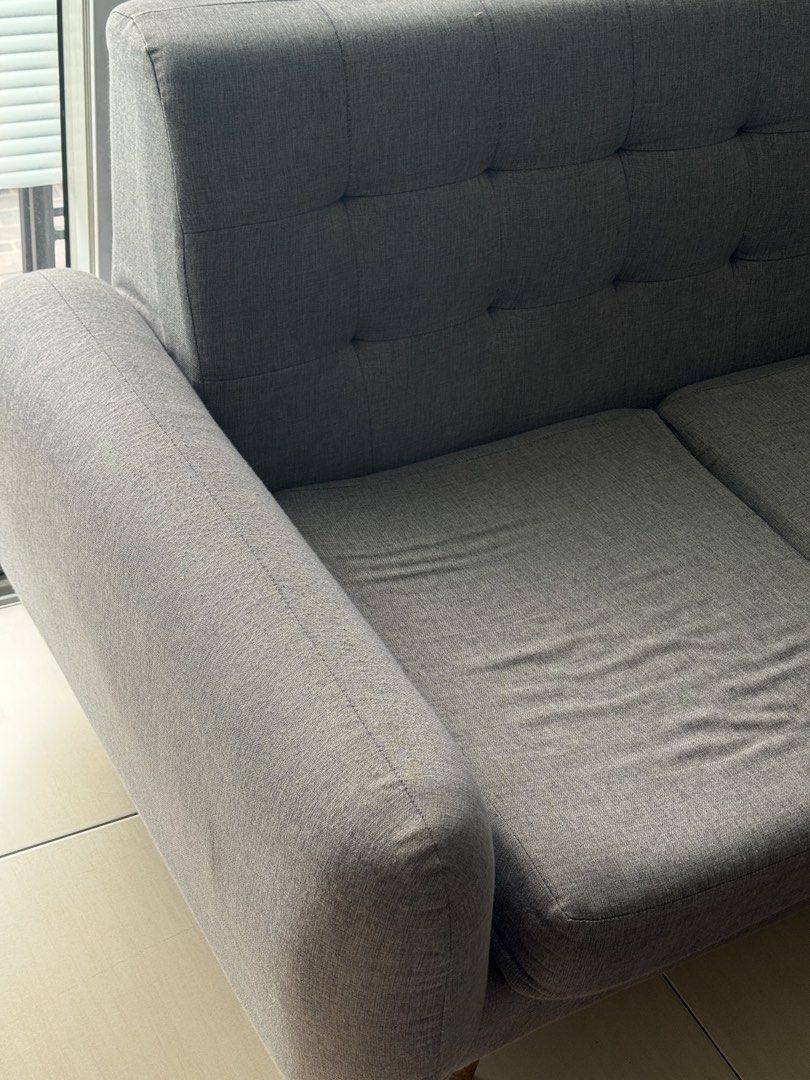 2-seater grey sofa with tall backrest / includes pillows (Category: Sofas) located in Quezon City. Submitted by mrzdc888 (Listing ID 1456095962, Image 2). Description: Originally bought for Php16,000 ✨ RFS: decluttering - Grey 2-seater sofa - Tall back and head rest. Good for the neck and back! - Includes 2 big pillows - Ideal for living rooms or studies - Used but still super cute - See photos for current status of couch DIMENSIONS Length: 57inc
