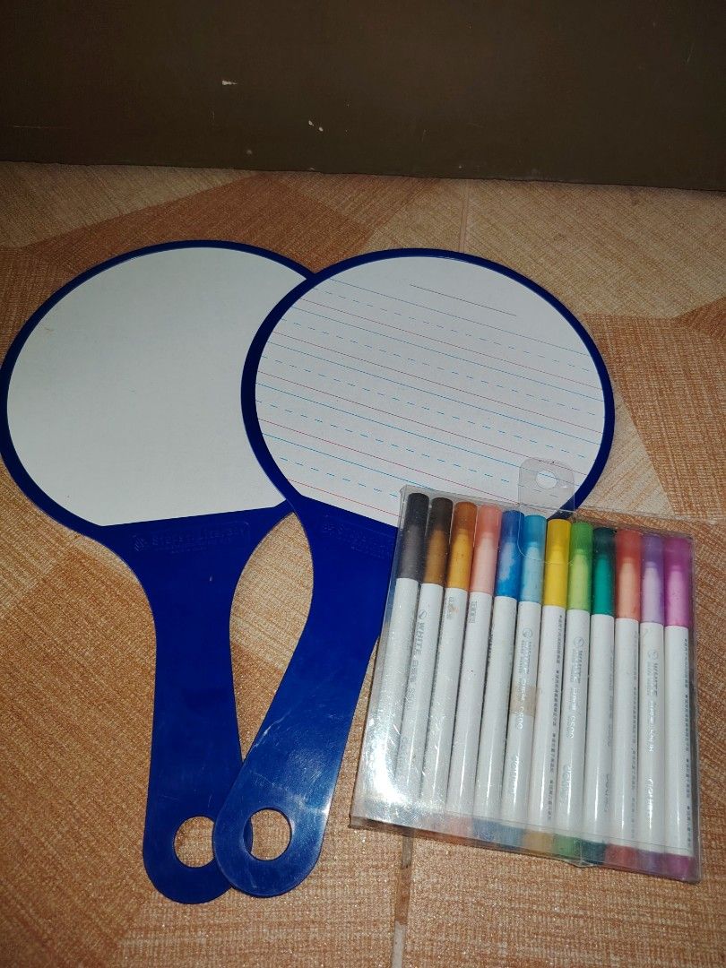 2x Dry Erase Paddle Boards with Markers (Category: Stationery & School Supplies) located in Santiago. Submitted by aceheart0118672 (Listing ID 1463586067, Image 2). Description: - Set of 2 blue handled dry erase paddle boards - One board is lined, the other is blank - Includes 10 colorful dry erase markers - Ideal for children learning to write - Great for quick notes and brainstorming - Easy to wipe clean - Markers come in a clear plastic case.
