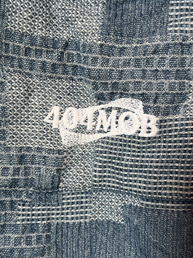 404MOB Button-Up Denim Long Sleeve Shirt Size L (Category: Tshirts & Polo Shirts ) located in Iriga City. Submitted by kjgonzales_ (Listing ID 1463582006, Image 3). Description: - Brand: 404MOB - Style: Button-up shirt - Graphic Print: Features 'Shut Up!' slogan and globe logo - Design: Unique all-over pattern - Pockets: Two chest pockets - Size: L - Occasion: Great for casual wear.