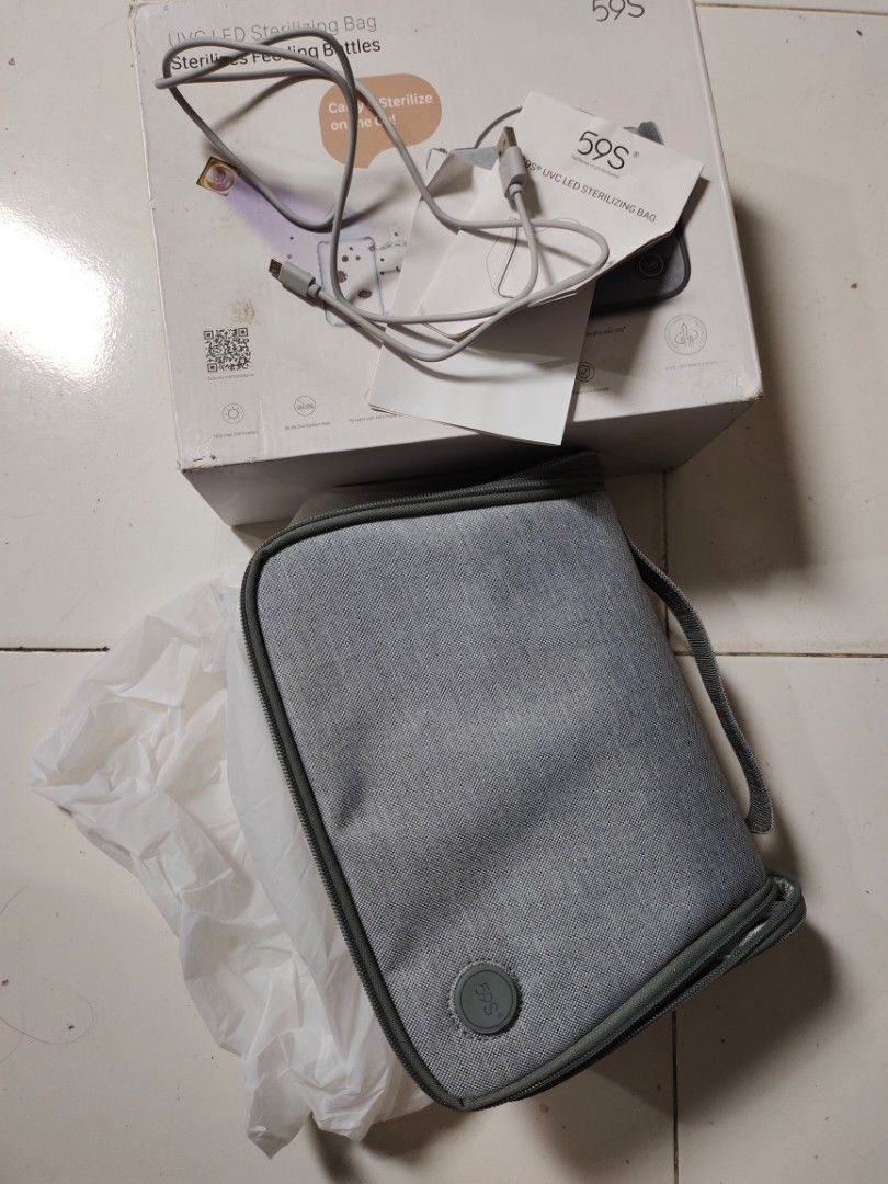 59S UVC LED Sterilizing Bag for Feeding Bottles (Category: Breastfeeding & Bottle Feeding) located in Tayabas. Submitted by lorrena (Listing ID 1463602734, Image 1). Description: - Portable UVC LED sterilizing bag - Perfect for sterilizing feeding bottles on the go - USB powered (cable included) - Easy to carry with handle - Secure zipper closure - Interior with multiple compartments - Comes with original box.