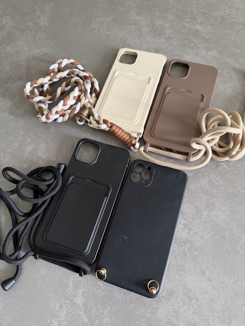7 iPhone 11 Pro Max Cases Bundle (Category: Cases & Sleeves) located in Taytay. Submitted by thestyletwins (Listing ID 1463600956, Image 2). Description: Selling my collection of 7 preloved iPhone 11 Pro Max cases as a bundle. Includes Louis Vuitton inspired monogram with hand strap, BURGA marble, iDeal of Sweden marble, plus 4 crossbody cases in cream, taupe and black with different straps. Three of the crossbody cases have convenient card pocke