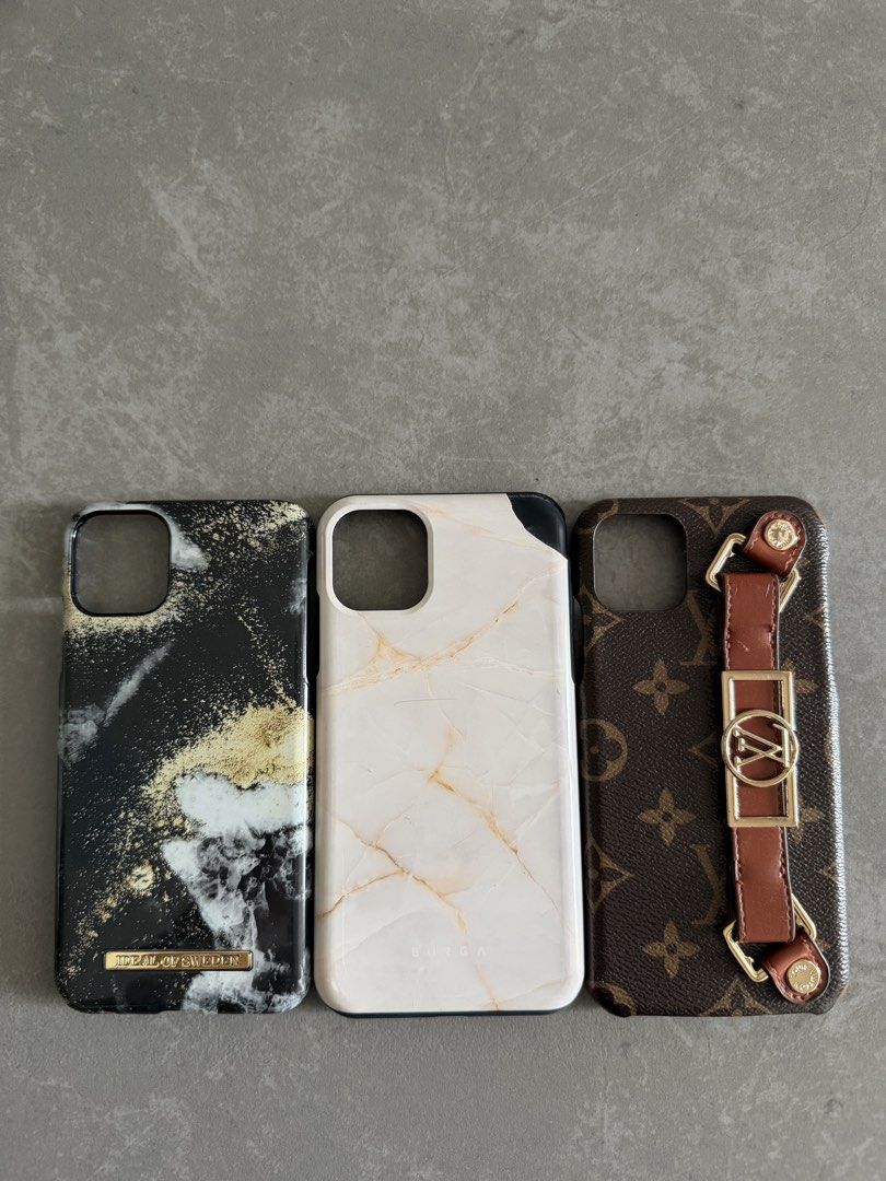 7 iPhone 11 Pro Max Cases Bundle (Category: Cases & Sleeves) located in Taytay. Submitted by thestyletwins (Listing ID 1463600956, Image 3). Description: Selling my collection of 7 preloved iPhone 11 Pro Max cases as a bundle. Includes Louis Vuitton inspired monogram with hand strap, BURGA marble, iDeal of Sweden marble, plus 4 crossbody cases in cream, taupe and black with different straps. Three of the crossbody cases have convenient card pocke