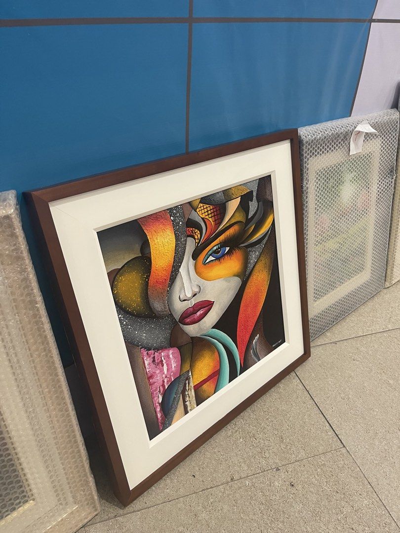 Abstract Face Painting Framed Art (Category: Art & Prints) located in Quezon City. Submitted by EricNathan25 (Listing ID 1463739128, Image 2). Description: - Framed abstract painting featuring a woman's face. - Boasts vibrant colors and bold, artistic lines. - Unique and eye-catching artistic style. - Comes ready to hang, making decorating easy. - An excellent addition to enhance your home decor..