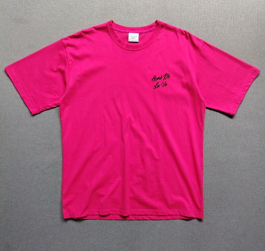 Acmē De La Vie Script Logo Tee (Bright Pink) (Category: Shirts) located in Taguig. Submitted by _theroom.ph (Listing ID 1463675777, Image 2). Description: - Pink Acme De La Vie (ADLV) T-Shirt - Features iconic ADLV logo graphic on both front and back - Classic crew neck and short sleeves - Made from comfortable, breathable material - Ideal for everyday casual styling.