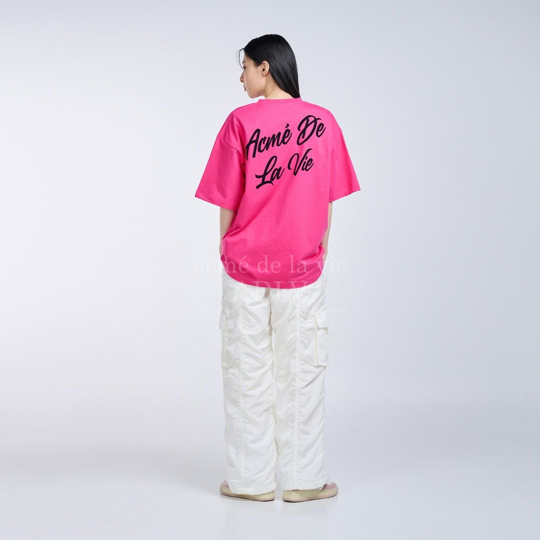 Acmē De La Vie Script Logo Tee (Bright Pink) (Category: Shirts) located in Taguig. Submitted by _theroom.ph (Listing ID 1463675777, Image 1). Description: - Pink Acme De La Vie (ADLV) T-Shirt - Features iconic ADLV logo graphic on both front and back - Classic crew neck and short sleeves - Made from comfortable, breathable material - Ideal for everyday casual styling.