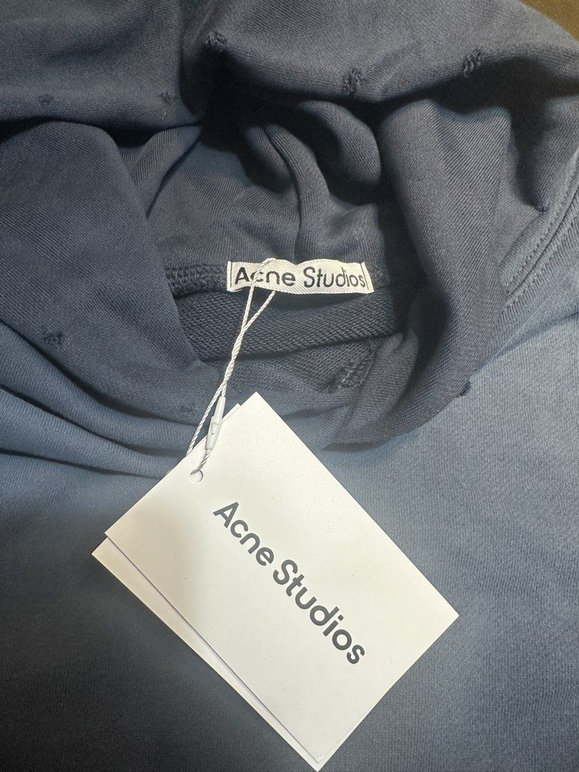 Acne Studios Hoodie (Category: Coats, Jackets and Outerwear) located in Quezon City. Submitted by cashflowww51 (Listing ID 1463705242, Image 3). Description: - Brand: Acne Studios - Type: Hoodie - Size: M - Material: Cotton - Color: Dusty Blue - Design: Features 'Acne Studios Stockholm 1996' print on the back - Condition: Layered Condition 3 (Good) - Style: Casual, everyday wear - Negotiable.