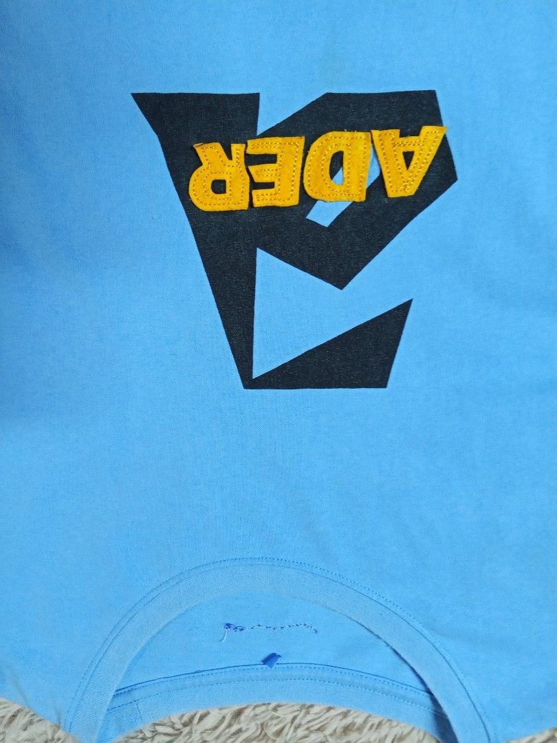 ADER Error Blue Graphic T-Shirt (Category: Tshirts & Polo Shirts ) located in Lucban. Submitted by aeronroyyy (Listing ID 1463625017, Image 2). Description: - ADER Error t-shirt in light blue - Features signature 'A' logo graphic on the front - Made in Korea - High-quality cotton for comfort - Perfect for simple, stylish everyday wear.