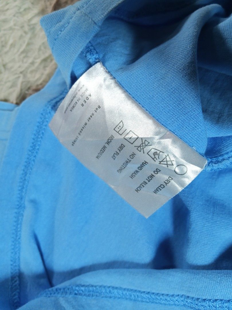 ADER Error Blue Graphic T-Shirt (Category: Tshirts & Polo Shirts ) located in Lucban. Submitted by aeronroyyy (Listing ID 1463625017, Image 3). Description: - ADER Error t-shirt in light blue - Features signature 'A' logo graphic on the front - Made in Korea - High-quality cotton for comfort - Perfect for simple, stylish everyday wear.