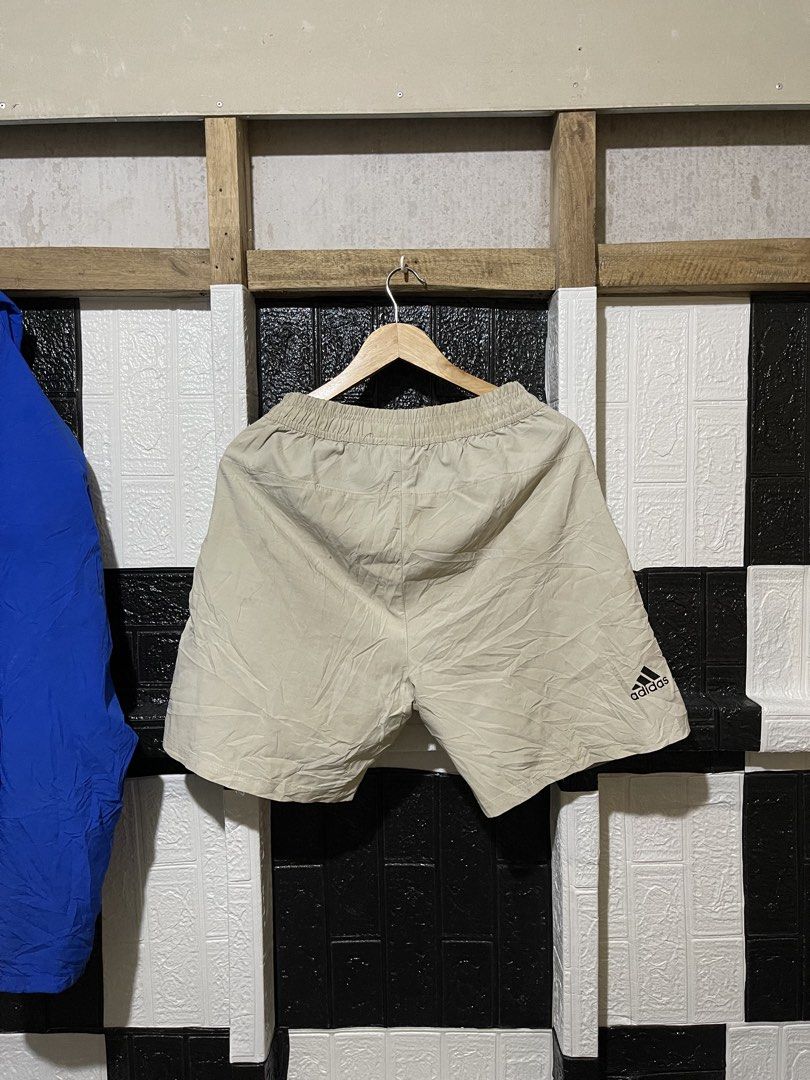 Adidas Beige Shorts Size L (Category: Shorts) located in Lopez. Submitted by thrift.ni.roms22 (Listing ID 1463700825, Image 2). Description: - Beige Adidas shorts - Size L - Elastic waistband with drawstring - Adidas logo on front and back - Two side pockets (one with zipper) - Ideal for sports or casual wear.