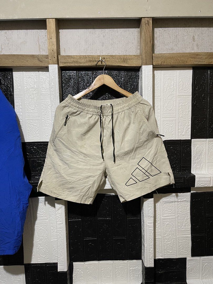 Adidas Beige Shorts Size L (Category: Shorts) located in Lopez. Submitted by thrift.ni.roms22 (Listing ID 1463700825, Image 1). Description: - Beige Adidas shorts - Size L - Elastic waistband with drawstring - Adidas logo on front and back - Two side pockets (one with zipper) - Ideal for sports or casual wear.