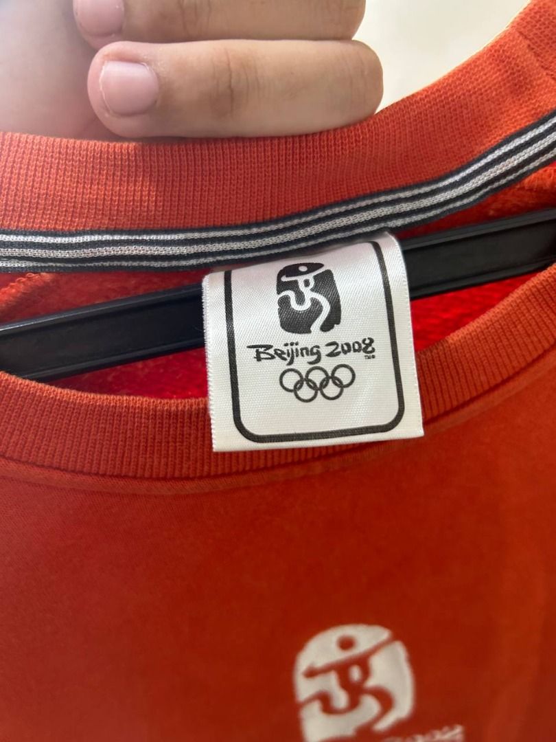 Adidas Beijing 2008 Olympics Crewneck (Category: Coats, Jackets and Outerwear) located in Taguig. Submitted by MoveQuickly (Listing ID 1463628247, Image 3). Description: - Orange Adidas crewneck sweatshirt - Size: L (28L x 18W) - Features Beijing 2008 Olympics logo and mascot - Classic Adidas three stripes on sleeves - Ideal for Adidas and Olympics enthusiasts - Comfortable and stylish.