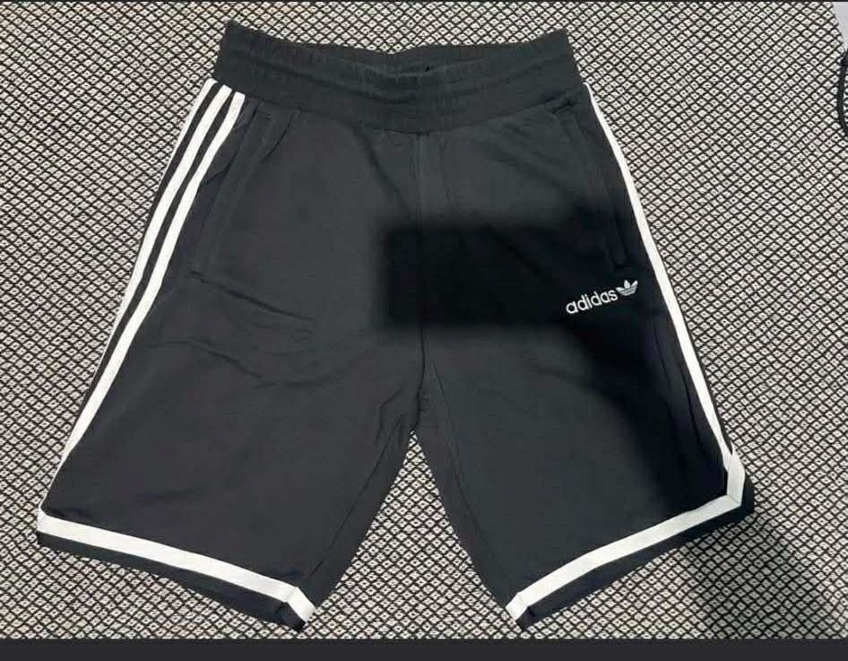 Adidas Black Shorts with White Stripes (Category: Activewear) located in Cainta. Submitted by patrickwilsonstore (Listing ID 1463610339, Image 2). Description: Adidas pre-game jogger shorts (cotton) Size: medium Length- 21 inches Color: black *used once Selling price: 799 neg SRP:2500.