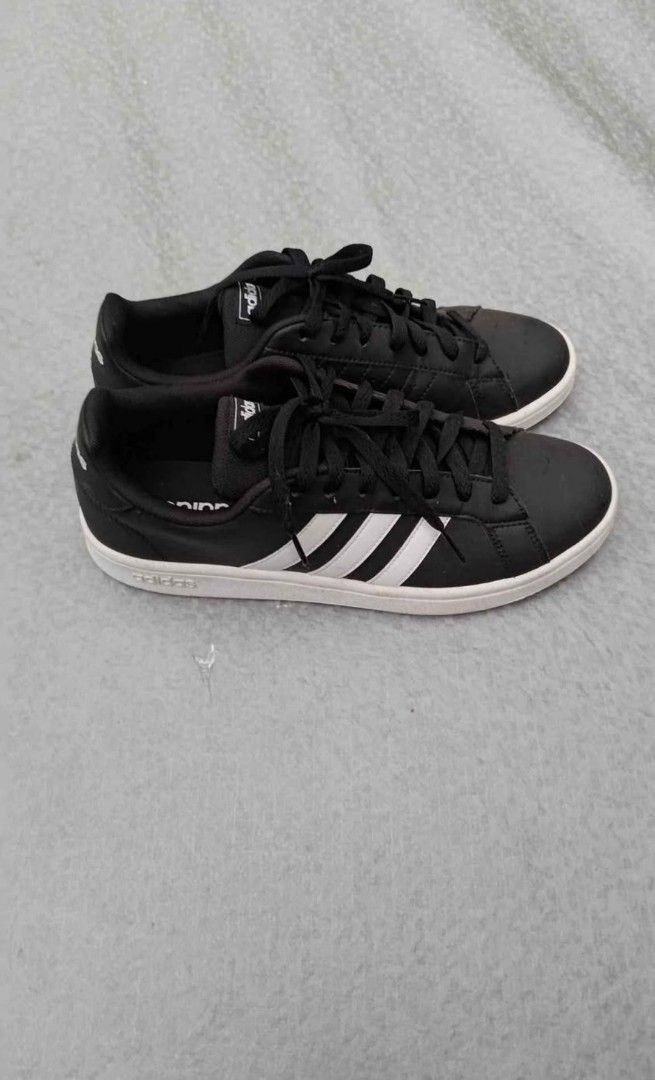 Adidas Black White Sneakers (Category: Sneakers) located in Manila. Submitted by 128105 (Listing ID 1463731561, Image 2). Description: - Classic black Adidas sneakers - Iconic white stripes - Secure lace-up closure - Soles show some wear, but plenty of grip remaining - Versatile for everyday wear and casual outings - Easy to pair with any outfit.