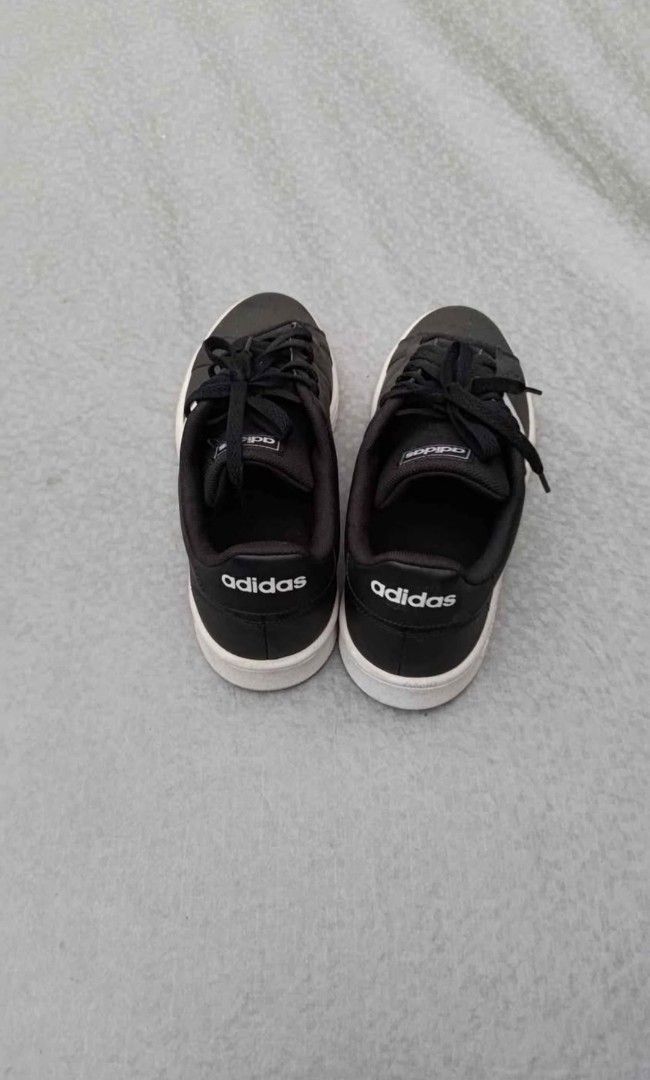 Adidas Black White Sneakers (Category: Sneakers) located in Manila. Submitted by 128105 (Listing ID 1463731561, Image 3). Description: - Classic black Adidas sneakers - Iconic white stripes - Secure lace-up closure - Soles show some wear, but plenty of grip remaining - Versatile for everyday wear and casual outings - Easy to pair with any outfit.