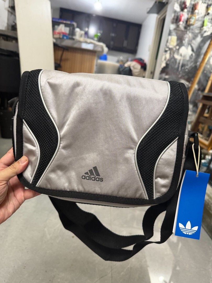 Adidas Messenger Bag (Category: Sling Bags) located in Quezon City. Submitted by tianprado (Listing ID 1463691190, Image 2). Description: Original, Brand New from Adidas color gray orig price 2500 sale price 1500.